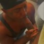 Black slut eating a masked dude cock in a public toilet