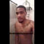 Black thug stroking his huge cock in the shower