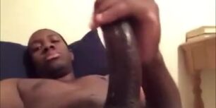 Cute young black dude stroking his tasty cock