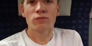 Handsome young blonde jerking off in a plane