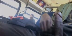 Young black stroking his cock on a bus