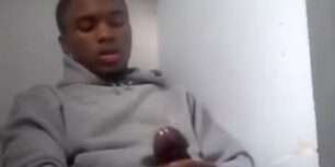 Cute young black dude strokes his mushroom head cock