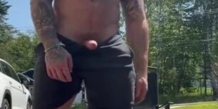 Handsome tattooed stud rubbing his huge tasty cock outdoor