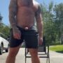 Handsome tattooed stud rubbing his huge tasty cock outdoor