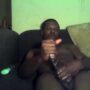 Mature black guy strokes his huge fat meaty cock on his sofa solo