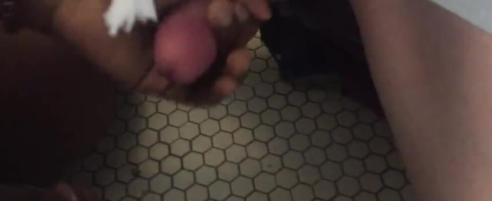 Masturbating a stranger under the bathroom door