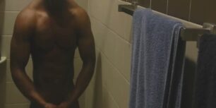 Muscled black guy jerking off while he showers