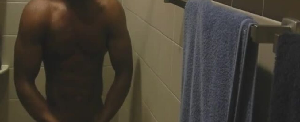 Muscled black guy jerking off while he showers