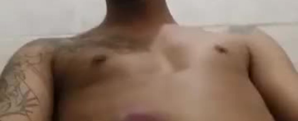 Tattooed latino guy rubbing his cock in front of the webcam