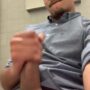 Handsome latino stroking his cock in a public toilet