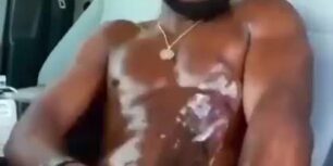 Oiled nigga rubbing his huge monster on his car