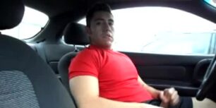 Handsome stud jerking off in the car