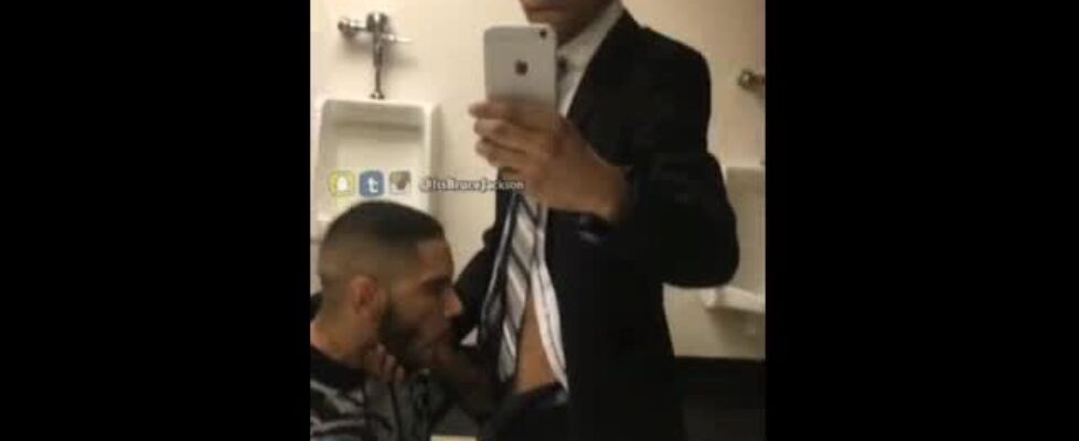 Latin stud sucks a stranger's cock in a public bathroom