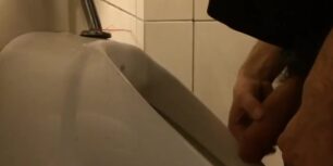 Masturbating in the public toilet while urinating