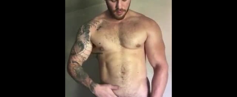 Tattooed young stud showing his sexy body and cock