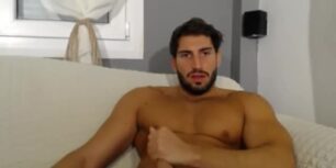 Beautiful tanned stud strokes his tasty monster cock