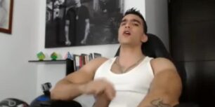 Handsome muscular stud jerks off in front of his computer