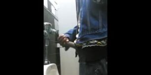 Caught a big dick jerking off in the urinals