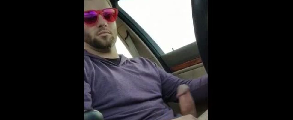 Cute guy with sunglasses jerking off in his car