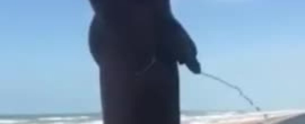 Pissing nude ath the beach