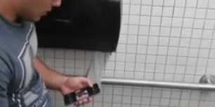 Spying a hot latino stroking his cock in public toilet