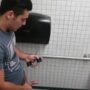 Spying a hot latino stroking his cock in public toilet