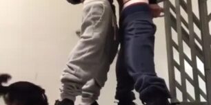 Horny young guy fucking on the stairs of the building