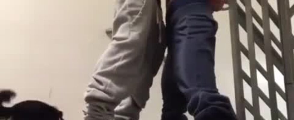 Horny young guy fucking on the stairs of the building