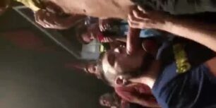 Sucking cock for a crowd in public
