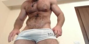 Big hairy muscle stud showing off