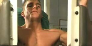 Cute young stud shows his cock and sexy body while training