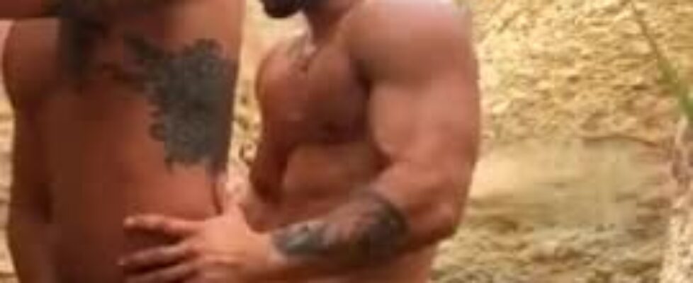 Two muscled stud enjoying a nice beach day