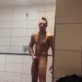 Cute yoing guy wankking his cock in a public shower