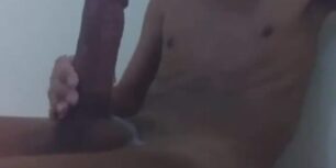 Skinny latin twink wanking his monster cock
