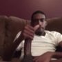 Big black dick strokes out in his living room